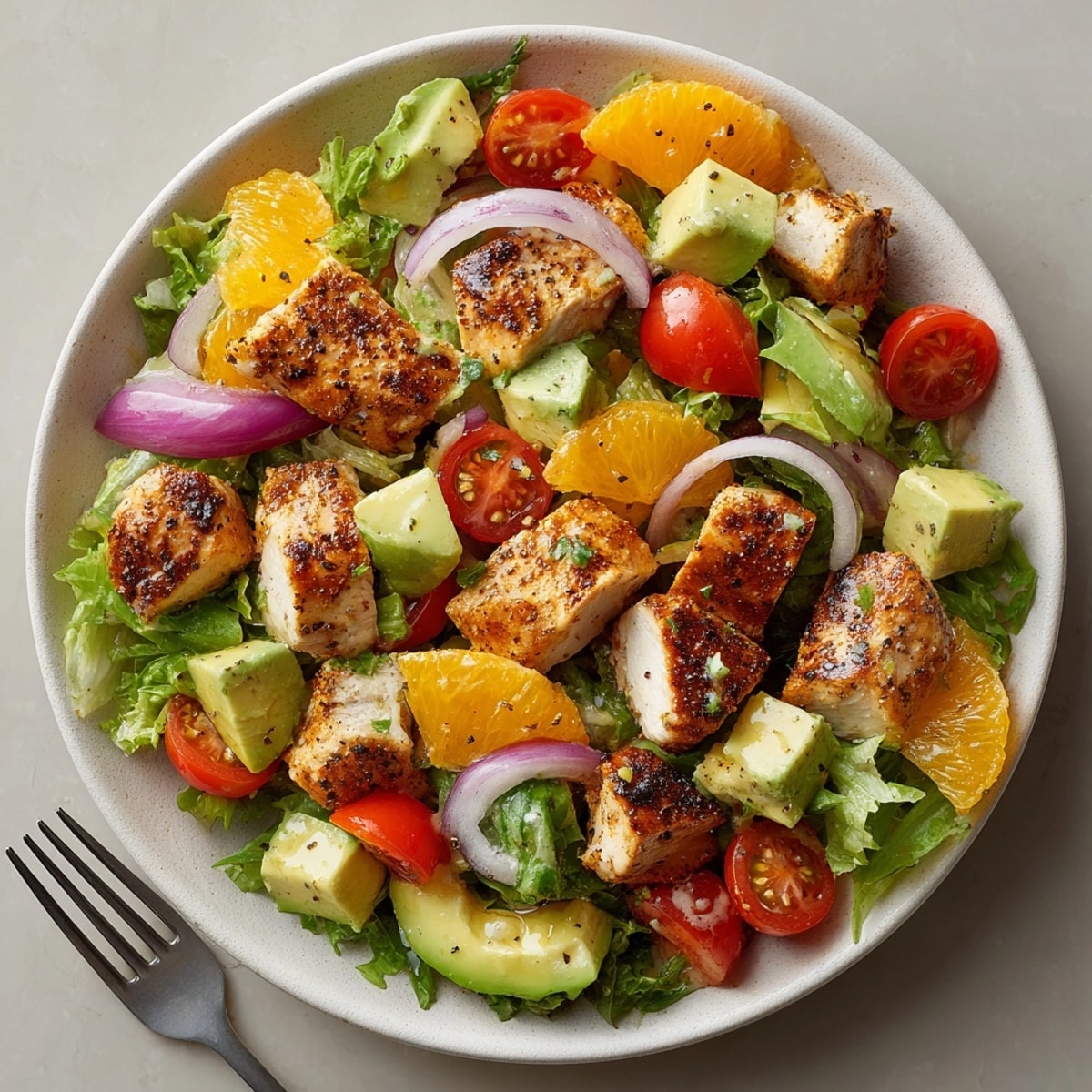 Easy Citrus Chicken and Avocado Salad, vibrant with cilantro, ready to enjoy outdoors.