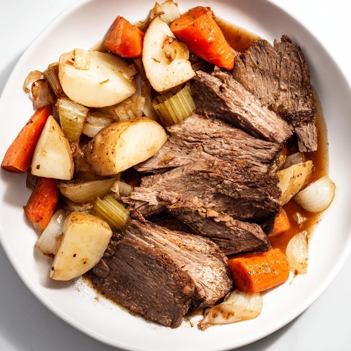 Tender Sunday Pot Roast with beautifully roasted veggies, served with rich, savory pan juices.
