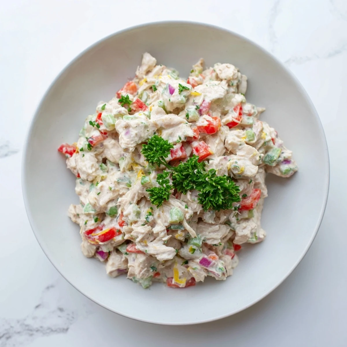 Fresh, easy canned chicken salad, combining diced vegetables with Mrs. Dash seasoning.