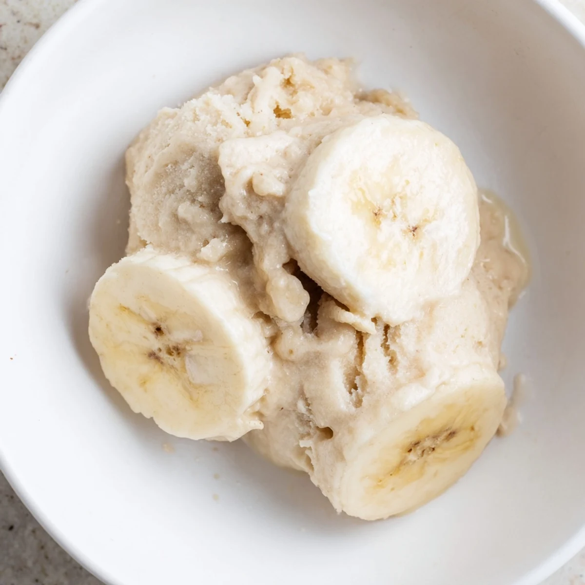 Smooth and creamy 2-Ingredient Banana Ice Cream, a healthy frozen dessert ready in minutes.