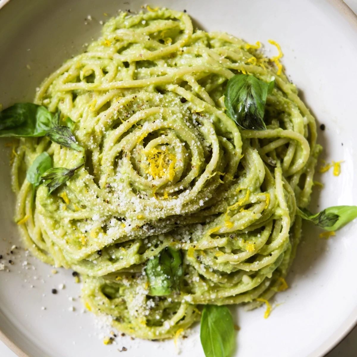 Delicious creamy avocado pasta ready to serve, featuring a smooth, flavorful sauce on pasta.