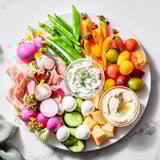 Fresh Spring Wreath Appetizer Platter features a beautiful arrangement of cheeses, meats, and veggies, ready to serve.