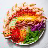 A close-up of the elaborate Mighty Dragon Lunar New Year board with fresh ingredients offering Asian flavors.