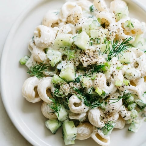 Creamy cucumber crunch pasta salad with tender shells, crisp cukes, and dill, topped with everything bagel seasoning for a perfect summer side.