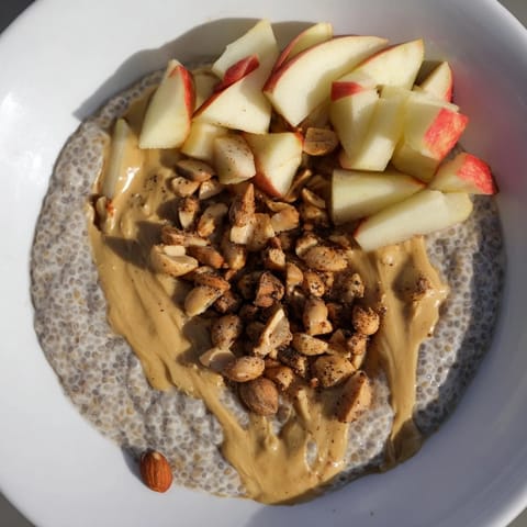 A layered serving of Apple-Chia Pudding: peanut butter, cinnamon apples, and a touch of maple syrup.