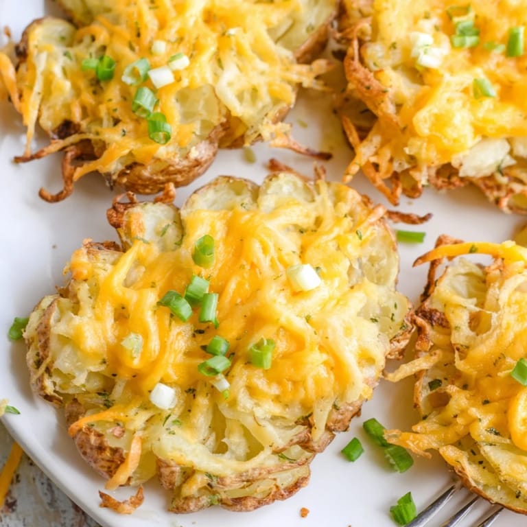 Golden-brown smashed green onion potato bombs served with creamy dipping sauce.  