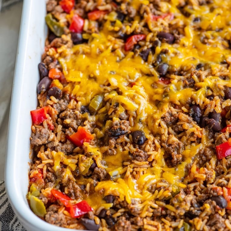 A close-up of a Tex-Mex Beef & Rice Casserole, showcasing the layered textures of rice and meat.