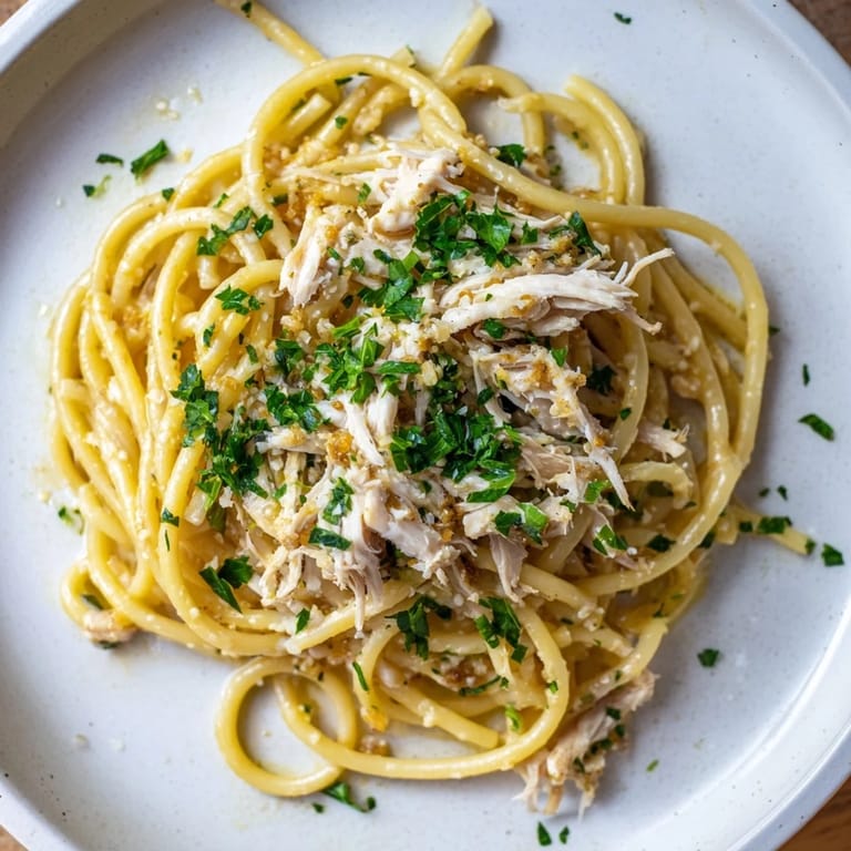 A close-up of buttery Simple Garlic Butter Bucatini, perfectly coated, ready to serve and enjoy.