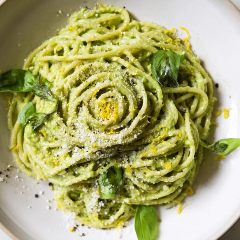 Delicious creamy avocado pasta ready to serve, featuring a smooth, flavorful sauce on pasta.