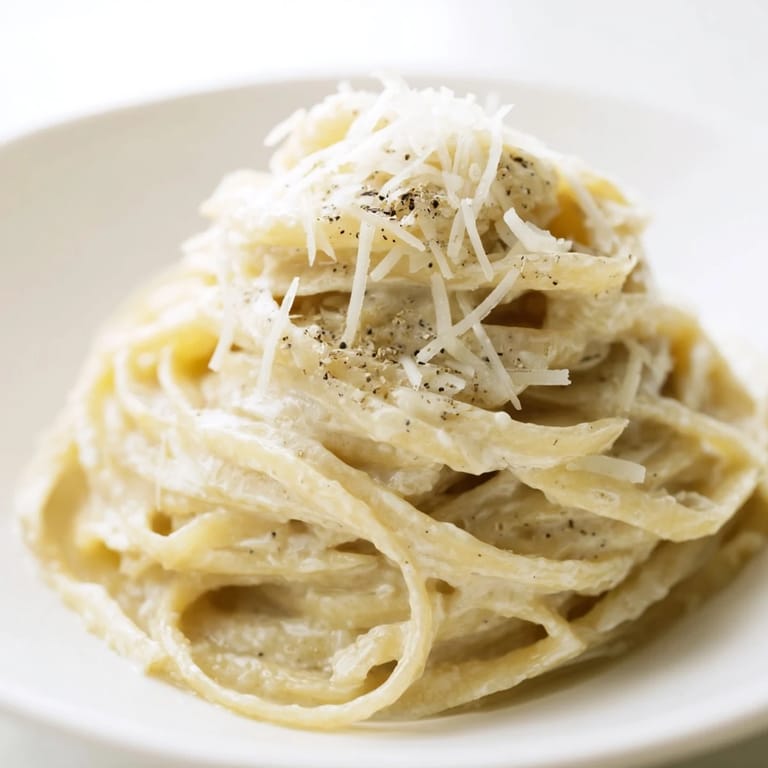 A visually appealing, close-up of golden Lazy Girl Three-Ingredient Pasta, ready to be enjoyed.