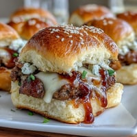 Vibrant BBQ sliders and fresh veggies arranged on a festive snack board for a baby shower or casual gathering.  
